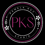 Pamela Kay Studio logo featuring a black circle with two inner white circles. The outer white circle is adorned with floral accents on the left and right. The business name 'Pamela Kay' is at the top, 'Studio' is at the bottom, both between two lines. The initials 'PKS' are prominently displayed in bright pink at the center.